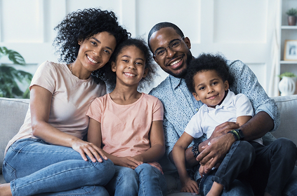 The Hartley family sits together at home.